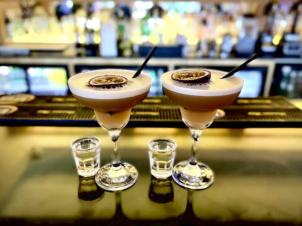 Two espresso martinis on the bar