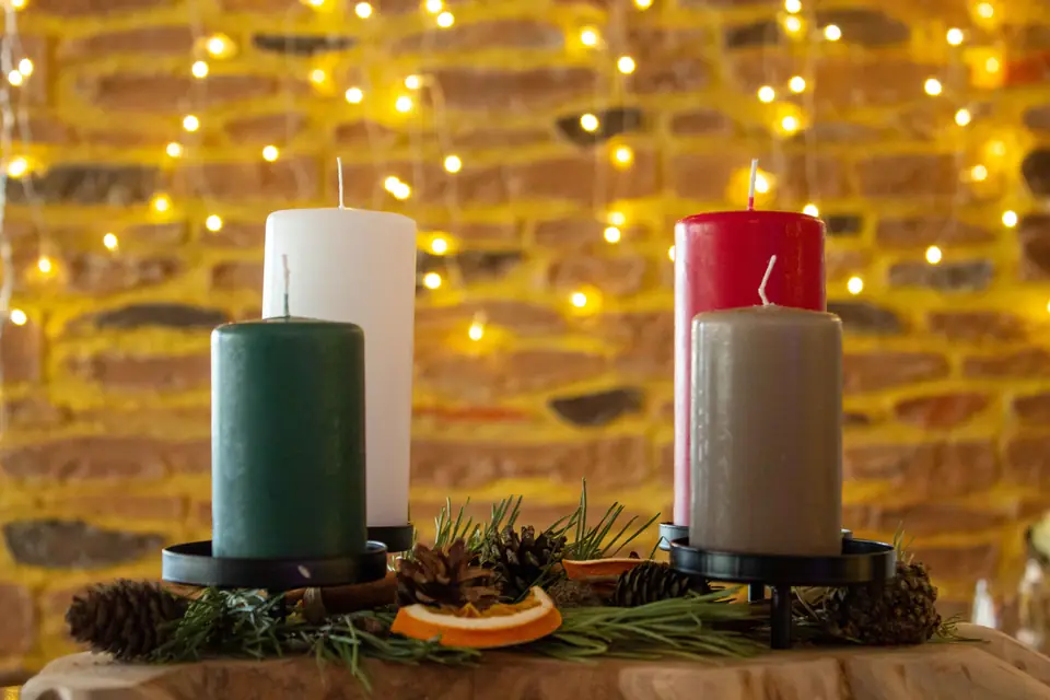 Christmas candles by the sandstone wall in the dining room